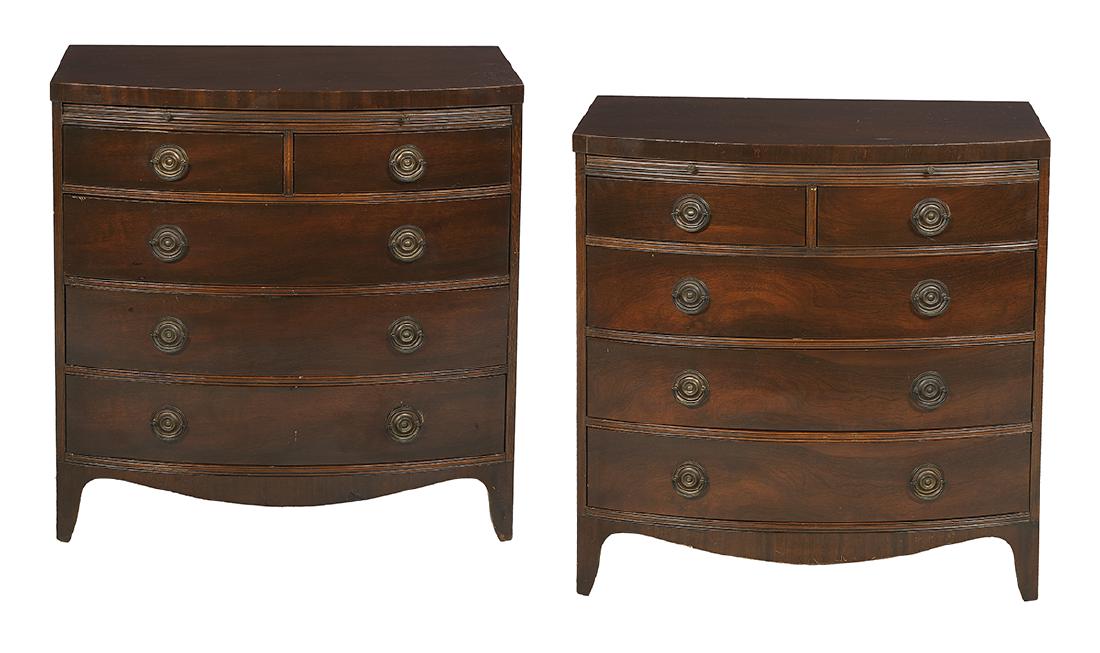 Pair of George III-Style Bachelor's Chests: Pair of George III-Style Mahogany Bowfront Bachelor's Chests each with a pair of drawers over a bank of three drawers, a work slide above the top drawer, a shaped apron and feet in the Hepplewhite tas