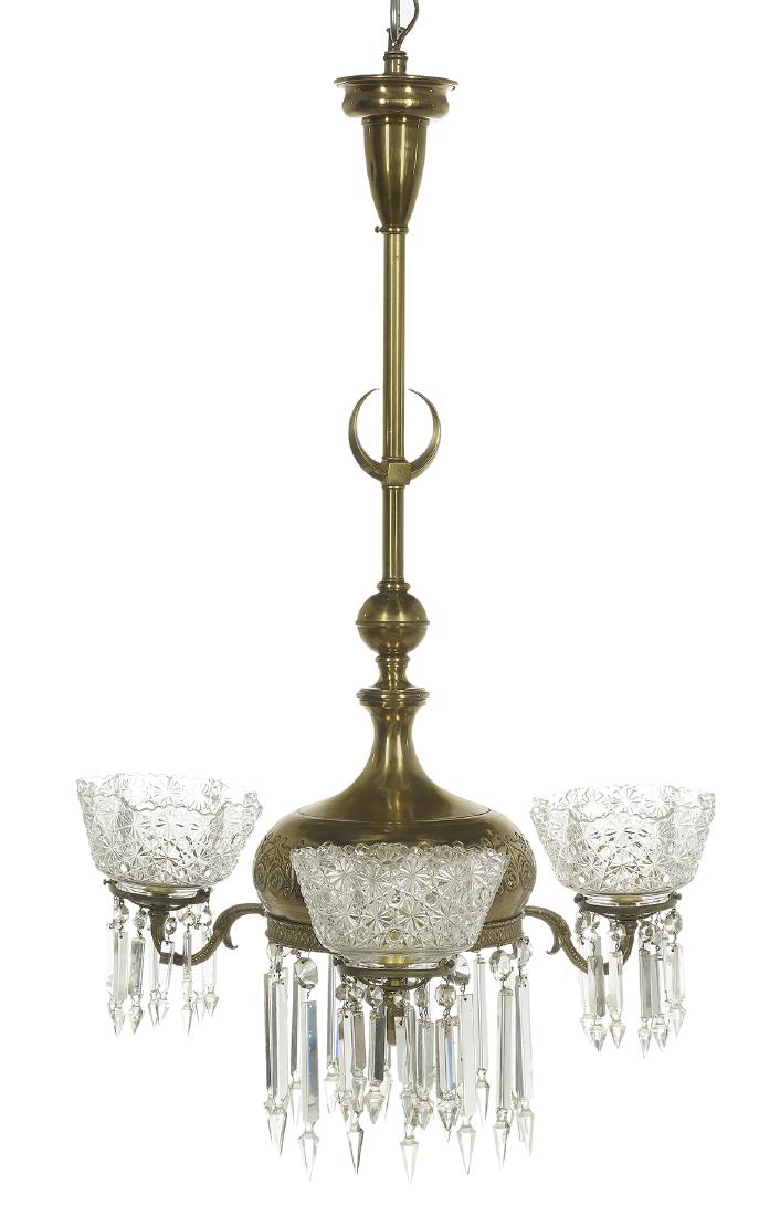 Brass Chandelier in the "Turkish" Taste: Brass Chandelier in the "Turkish" Taste fourth quarter 19th century, probably American, with an Islamic "moon" on the support rod, the main body impressed with Middle Eastern-style scrollwork, the lea
