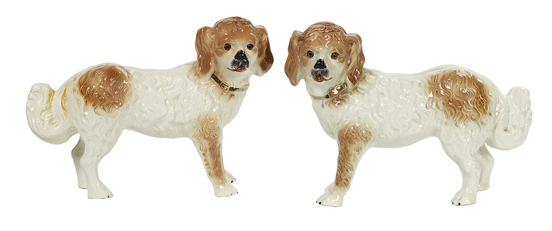 Pair of Victorian Staffordshire Newfoundlands: Pair of Victorian Staffordshire Pottery Newfoundlands fourth quarter 19th century, English, the brown and white dogs with glass eyes and gilt collars. h. 11", w. 13", d. 4-1/4" Provenance: Bruce McCas