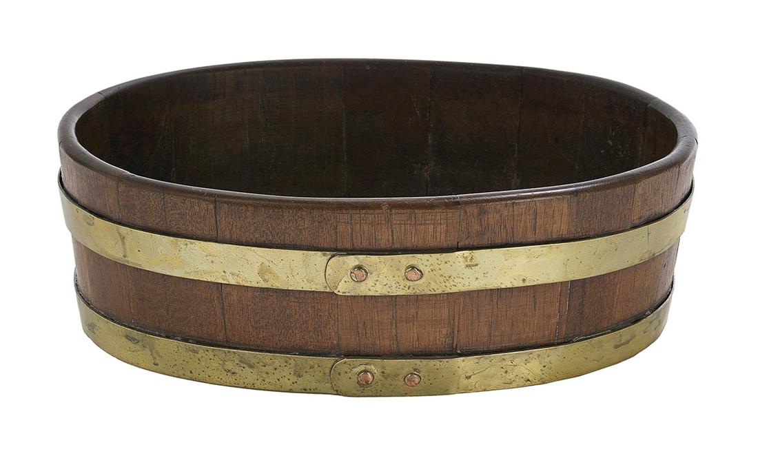 English Brass-Bound Mahogany Oval Oyster Bucket: English Brass-Bound Mahogany Oval Oyster Bucket 19th century, in the Regency style. h. 5-1/2", w. 15-3/4", d. 12-1/2" Provenance: Bruce McCashin Collection.