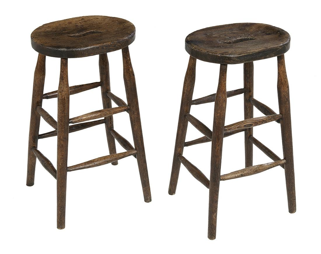 Pair of English Oak Pub Stools: Pair of English Oak Pub Stools 19th century, each with an ovoid top with central piercing and raised on splayed bulbous legs joined by two tiers of box stretchers. h. 24", w. 14", d. 10-1/2" Provenanc