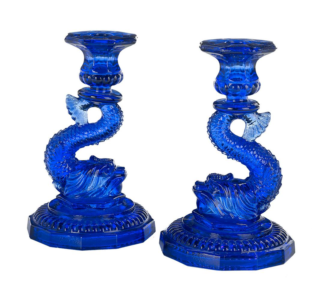 Pair of Molded Cobalt Glass Candlesticks: Pair of Boston and Sandwich-Style Molded Cobalt Glass Candlesticks 20th century, American, with classical dolphin-form standards. h. 7-3/4", dia. 5" Provenance: Bruce McCashin Collection.