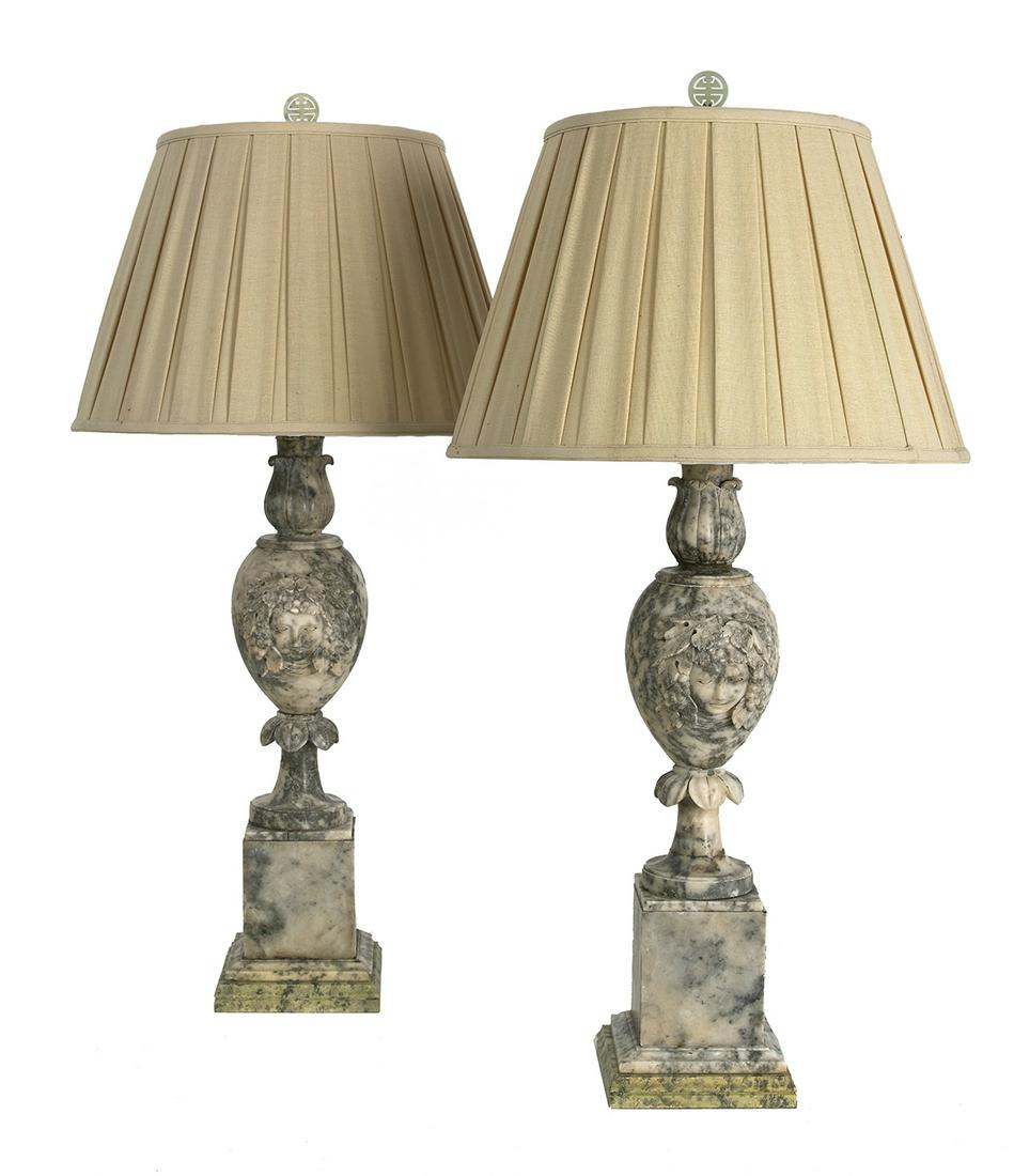 Pair of Italian Mottled Marble Lamps: Pair of Italian Mottled Marble Lamps second quarter 20th century, the fronts carved with bunches of grapes, set with pleated shades. h. 35-3/4", dia. 15" Provenance: Bruce McCashin Collection.