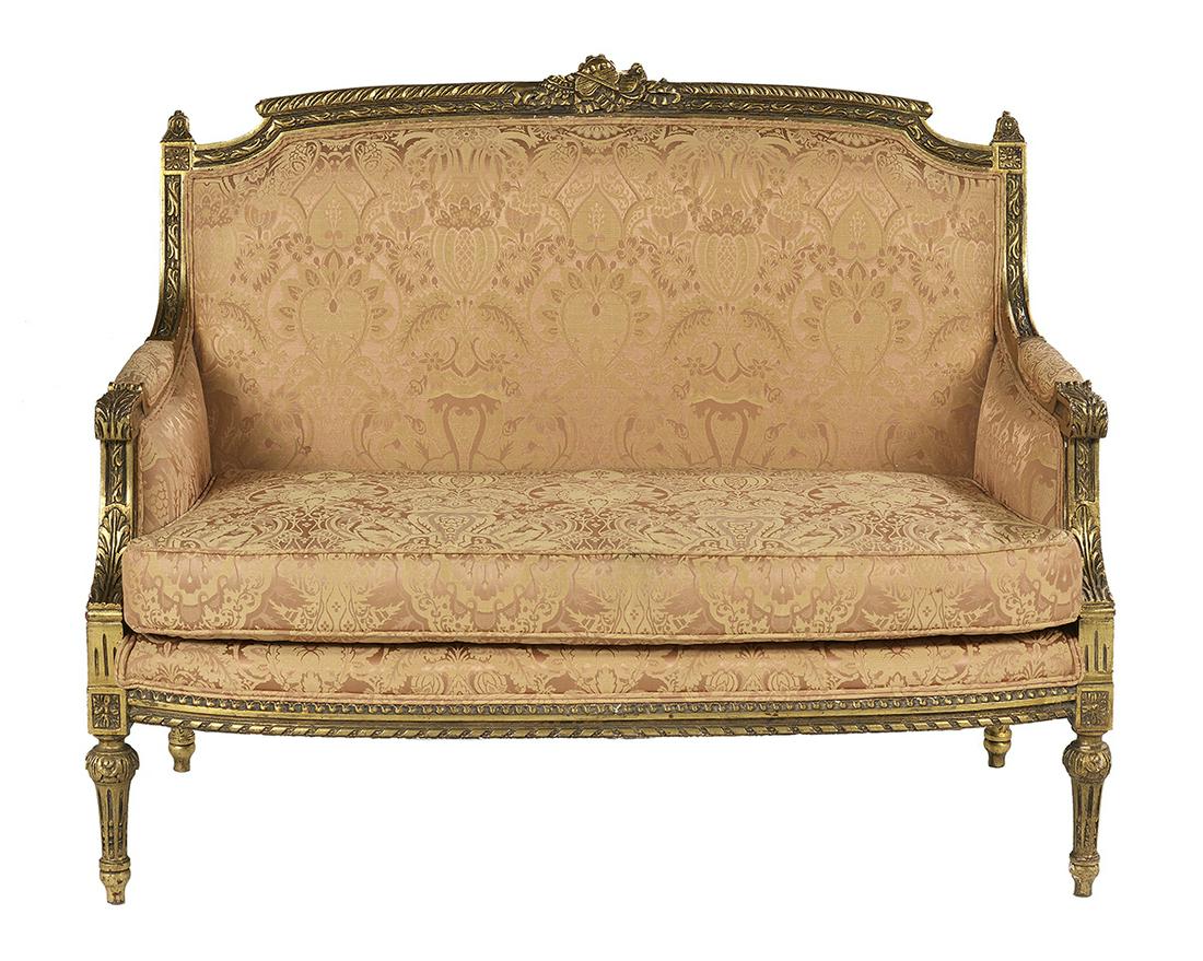 Louis XVI-Style Giltwood Settee: Louis XVI-Style Giltwood Settee 20th century, the padded and slightly domed back surmounted by a molded frame and musical crest, joined by padded arms to the cushioned seat, raised on stop-fluted tape