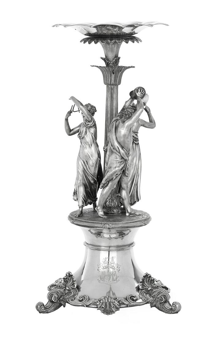 Good Victorian Silverplate Centerpiece: Good Victorian Silverplate Centerpiece second quarter 19th century, with a central columnar standard surrounded by three neoclassical figures in a musical Bacchanalian procession, the standard surmoun