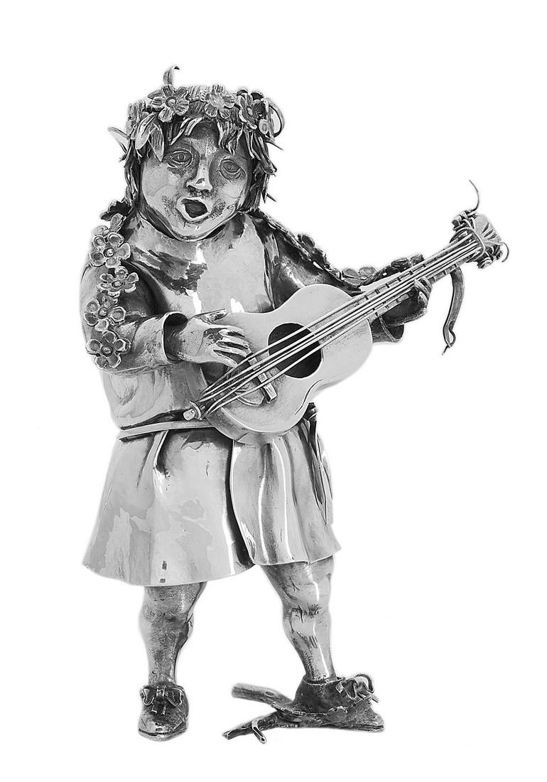 Buccellati Sterling Silver Figure of a Minstrel: Gianmaria Buccellati Sterling Silver Figure of a Minstrel contemporary, by Mabuti, Milan, the figure depicted in a tunic with floral wreath and garland, playing a guitar and singing. h. 4-3/4", w. 3-3