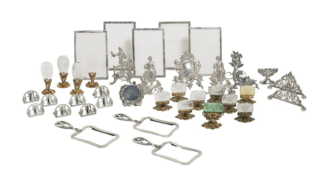 Thirty-Eight Assorted Menu/Place Card Holders: Thirty-Eight Assorted Menu/Place Card Holders 19th and 20th centuries, including: a Continental gilt metal and glass set of four, openwork base set with rhinestones, with inverted teardrop-shaped colo