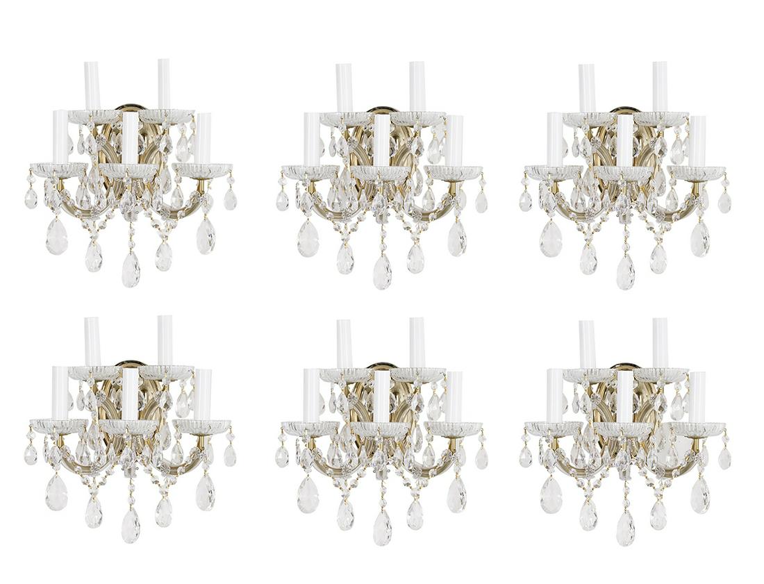 3 Pairs of Maria Theresa-Style Crystal Sconces: Three Pairs of Maria Theresa-Style Crystal Sconces 20th century, each with a brass-plated backplate supporting five candlearms with glass bobeches hung with swags of prisms and cut glass drops. h. 17"