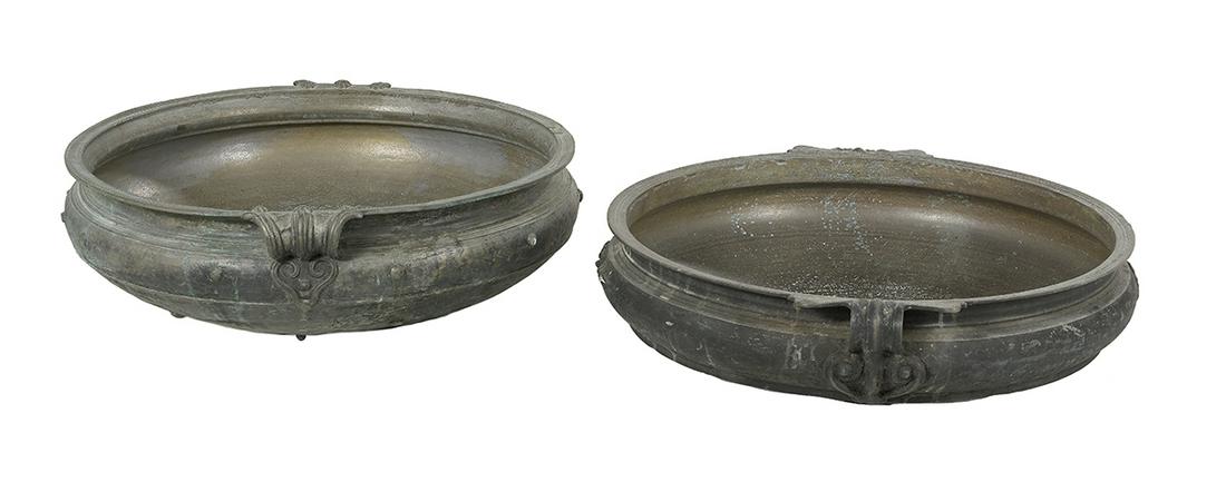 Two Bronze Low Basin-Form Jardinieres: Two Bronze Low Basin-Form Jardinieres 20th century, of Middle Eastern inspiration, with leaf-molded handles, the sides with "nailhead" decoration. h. 8-1/2", w. 31", d. 28-1/2"