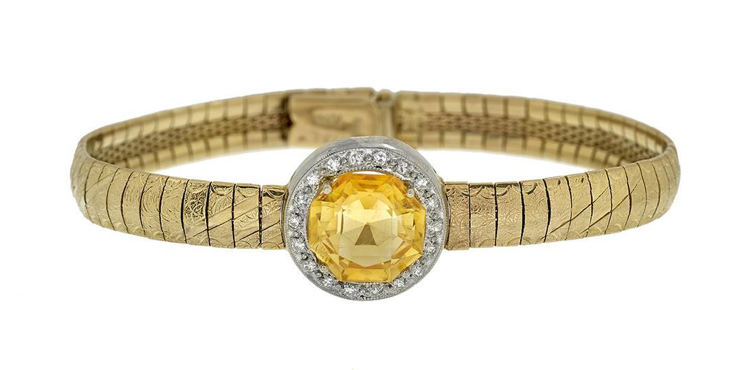 Yellow Sapphire and Diamond Bracelet: Yellow Sapphire and Diamond Bracelet 10k yellow gold, the bracelet mounted with a round-cut treated yellow sapphire weighing approximately 4.00 carats, surrounded by a halo of single-cut diamonds weig