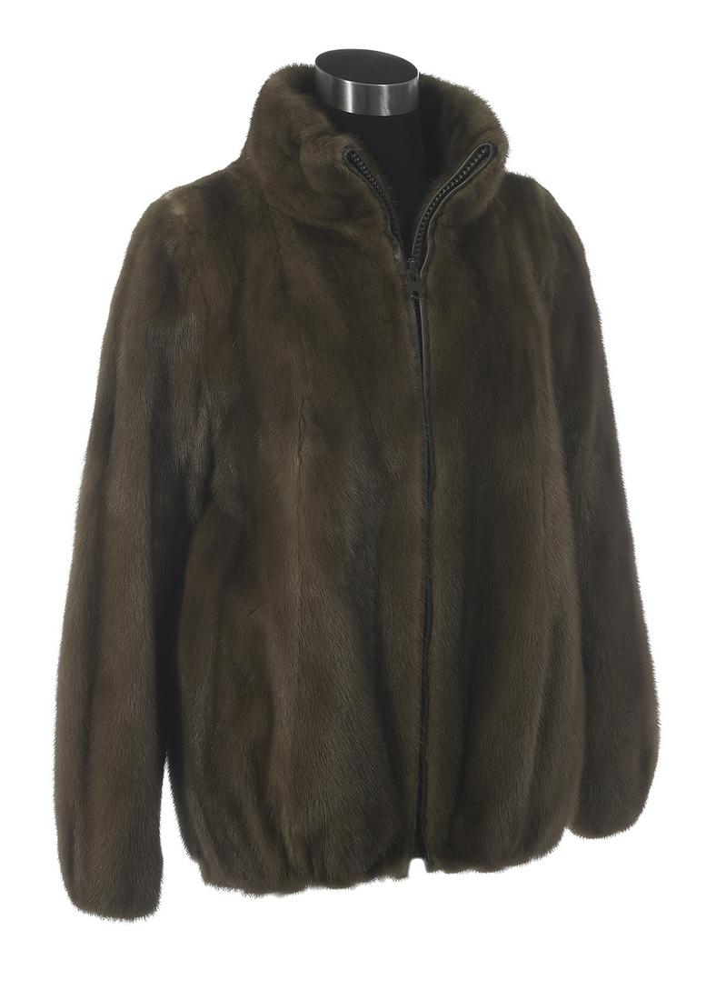 Lady: Lady's Zippered Taupe Mink Jacket size 8, with stand up collar, inset sleeves, zippered closure and on-seam pockets, the cuffs and hem elasticized, the coffee satin-lined interior labeled "Nigbor's of