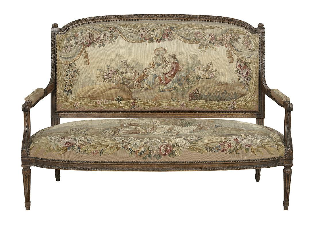 Louis XVI-Style Beechwood Sofa: Louis XVI-Style Beechwood Sofa late 19th century, with a carved top rail and stiles joined to shaped open arms with beaded scroll ends, a bound seat rail and tapering fluted and stop-fluted front legs