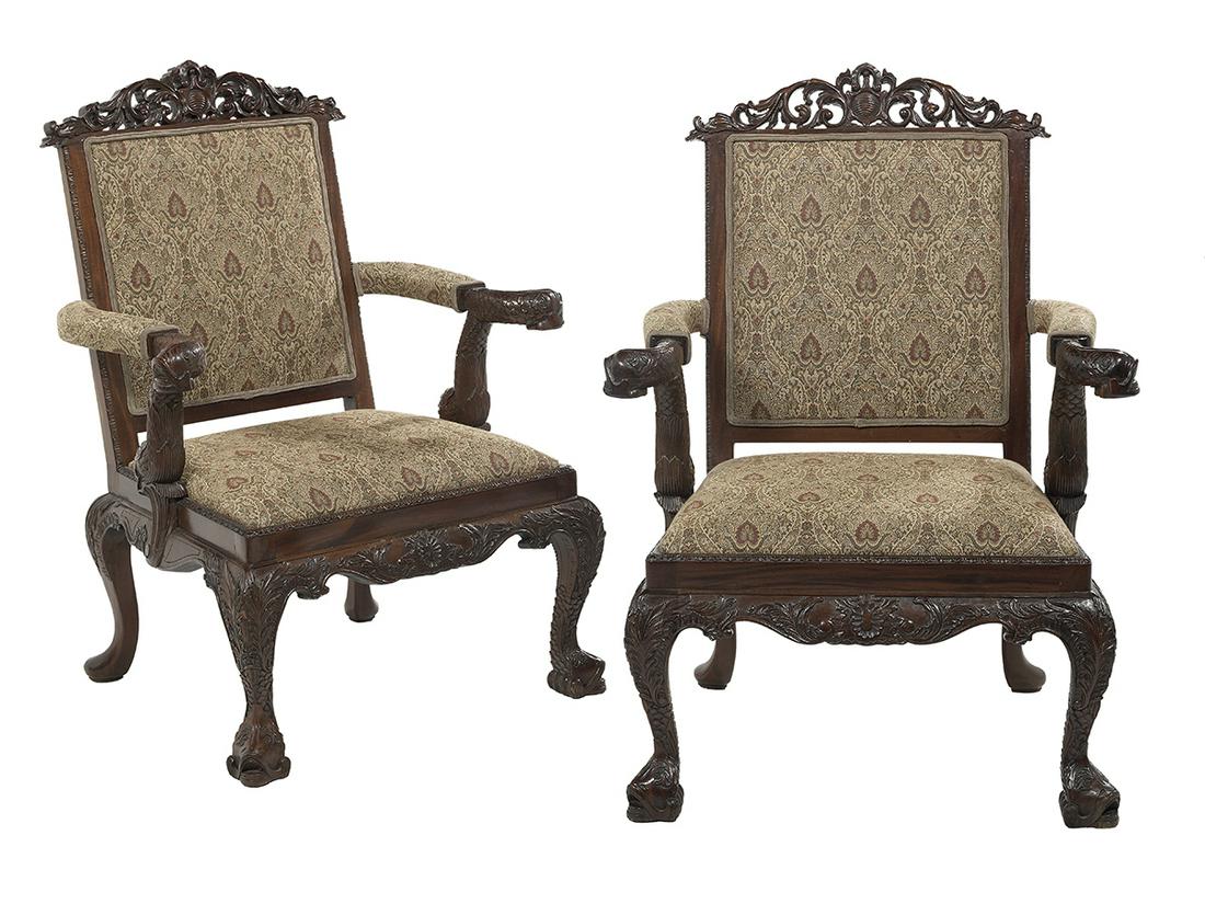Pair of Mahogany Dolphin-Carved Armchairs: Pair of Mahogany Dolphin-Carved Armchairs each with a pierced foliate- and cabochon-carved crest over a back with an upholstered panel, the open arms terminating in dolphin-carved ends and raised on l
