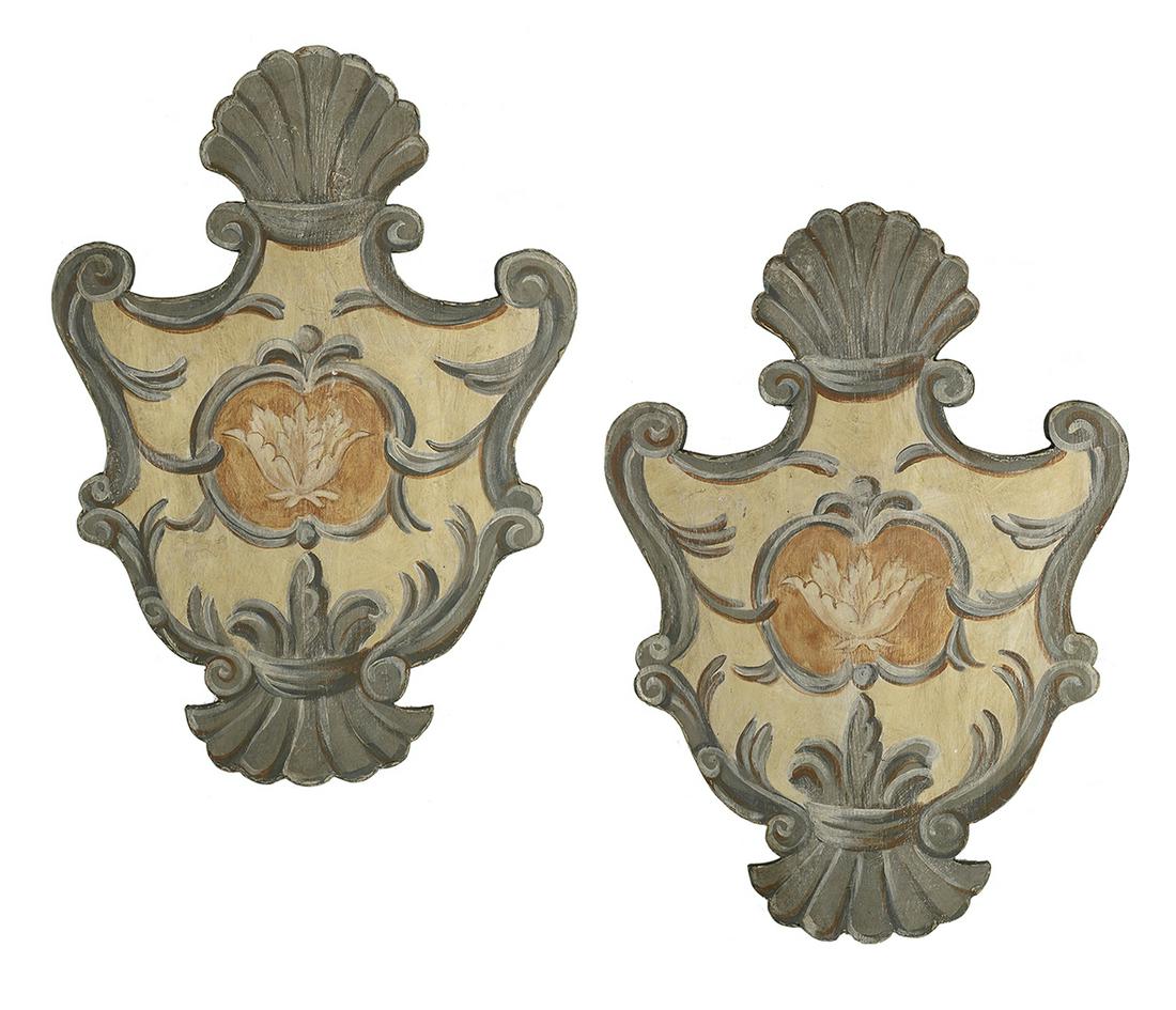Pair of Provincial Polychrome Wooden Shields: Pair of Provincial Polychrome Wooden Hanging Shields 20th century, French, in the baroque taste, painted en grisaille, with scrolled surrounds and shell crests, the centers with painted flowers. h. 31