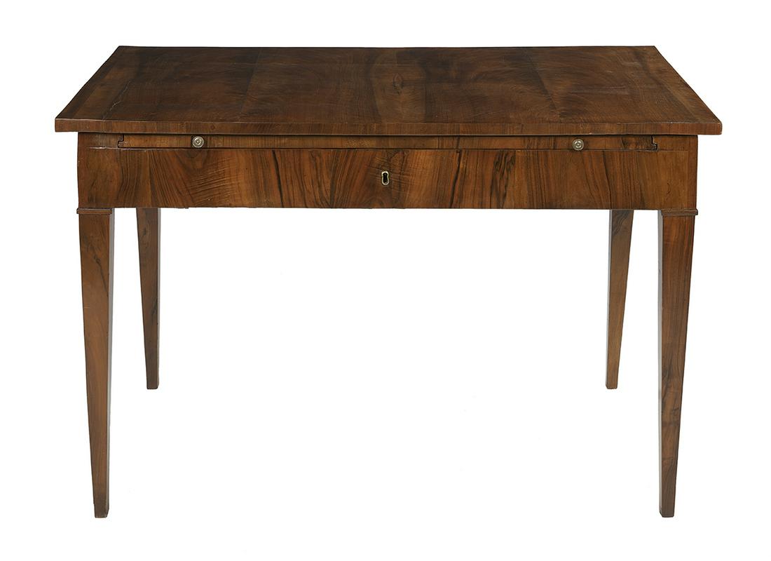 Biedermeier Fruitwood and Walnut Library Table: Biedermeier Fruitwood and Walnut Library Table 19th century, the top sliding back to reveal a pull-out writing slide with an inset leather writing surface and a storage well below, raised on tapering 