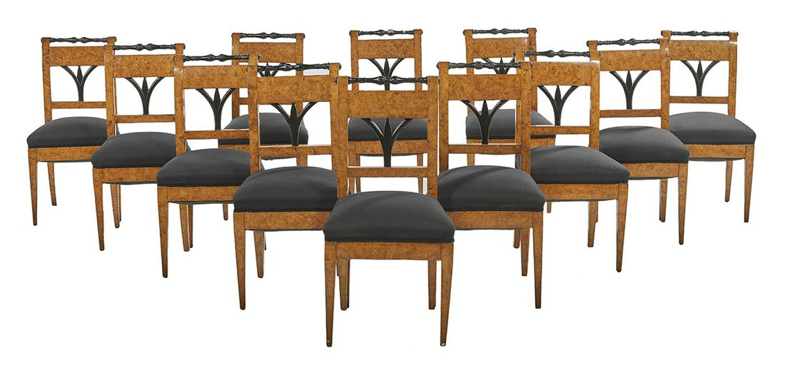 Twelve Biedermeier Ebonized and Elm Dining Chairs: Suite of Twelve Biedermeier Parcel-Ebonized and Burled Elm Dining Chairs early 19th century, each back with a turned and shell-carved spindle over a figured rail and shaped ebonized splat, raised on t