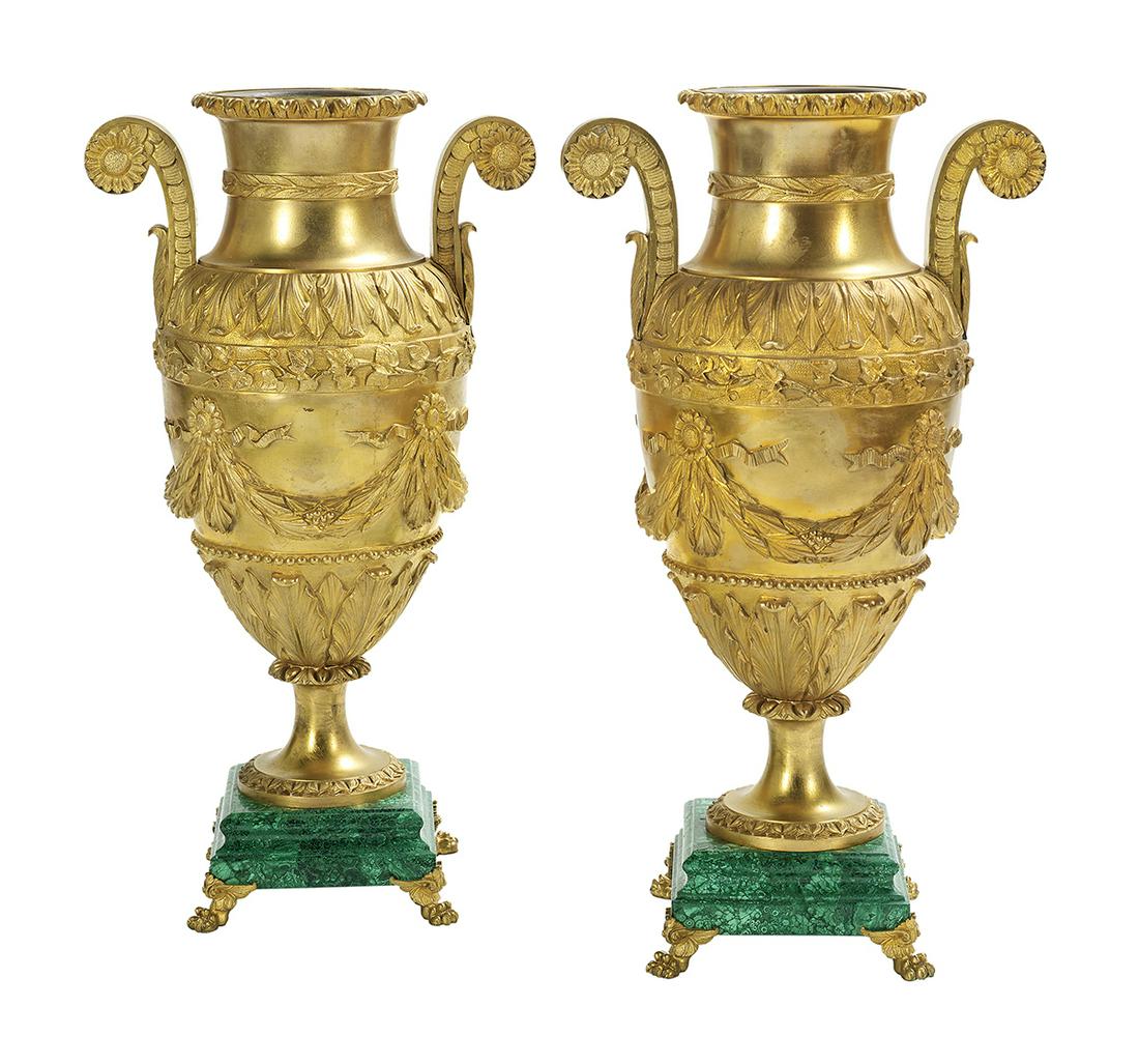 Pair of Gilt-Bronze and Malachite Urns: Pair of Gilt-Bronze and Malachite Urns in the Empire Taste first quarter 20th century, Russian or French, the urns with sunflower-molded handles, the sides with swags of laurel leaves hung from sunflo