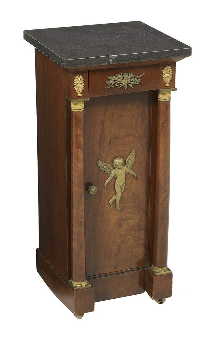 Empire Mahogany and Marble-Top Cabinet: Empire Mahogany and Marble-Top Cabinet 19th century, the rounded square marble top above a conforming case fitted with a single drawer over a single recessed cupboard door, centered by an ormolu cheru