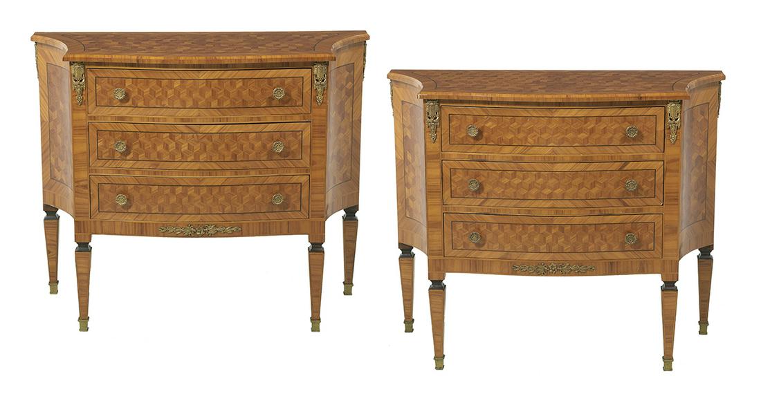 Pair of Louis XVI-Style Parquetry Commodes: Pair of Louis XVI-Style Fruitwood Parquetry Commodes each with a banded and heavily canted top above a conforming case fitted with three drawers, raised on tapering square legs ending in sabots, the w