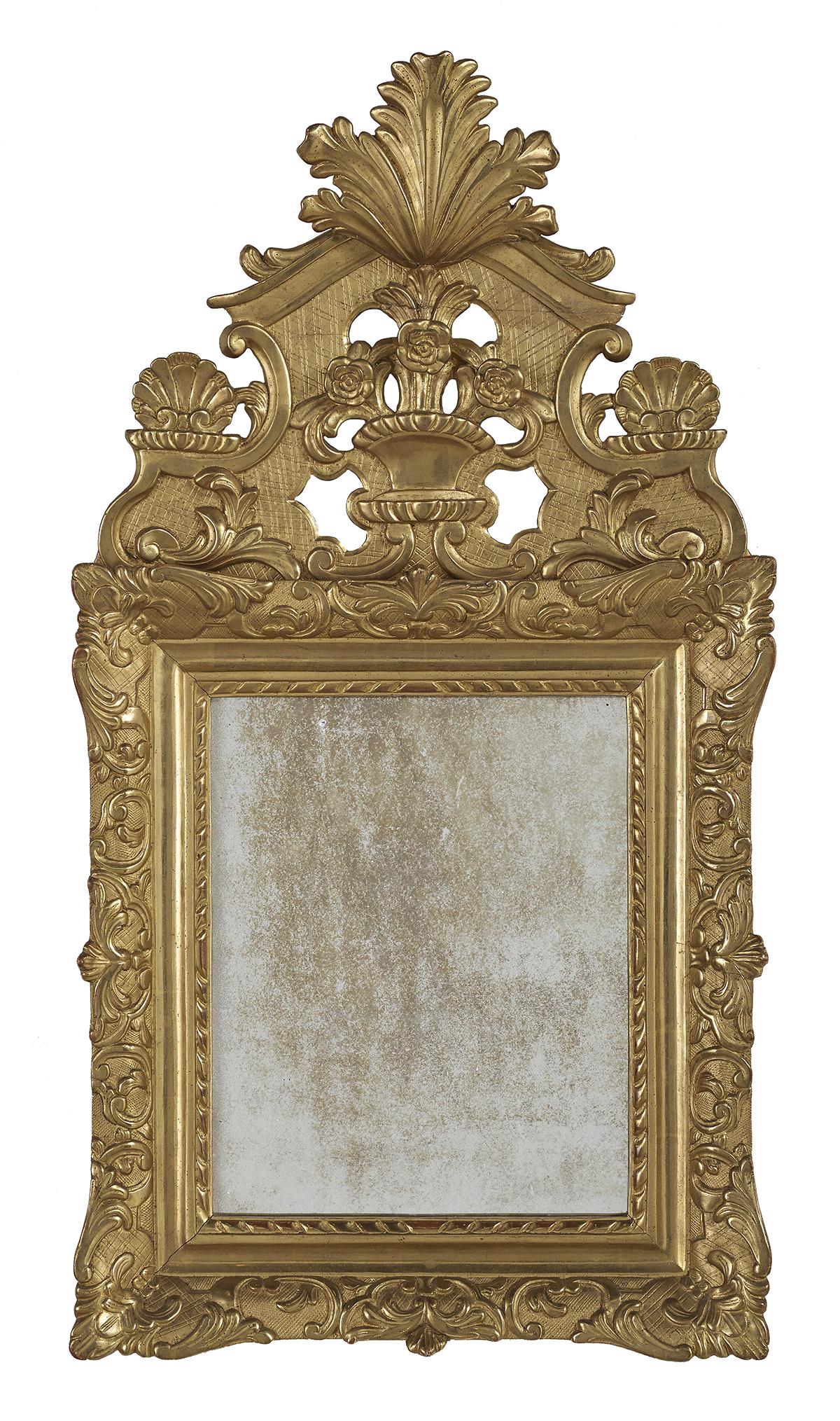 French Baroque-Style Giltwood Mirror: French Baroque-Style Giltwood Mirror fourth quarter 19th century, the pedimented crest with a leaf-carved finial with a basket of flowers on a lattice-incised ground, the mirror surround with scrollwo
