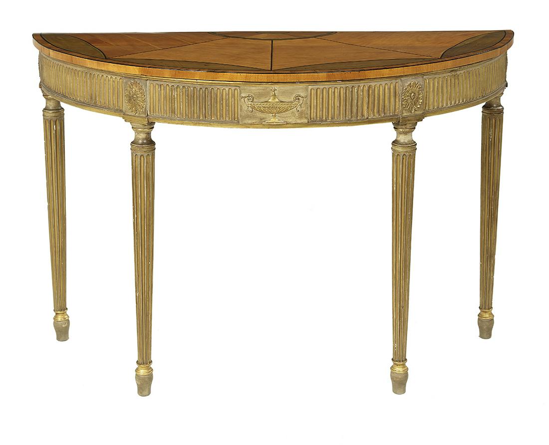 George III Satinwood and Giltwood Side Table: George III Satinwood and Giltwood Side Table early 19th century, in the Adam taste, the demi-lune top banded and with a half patera and sunburst inlay, above a conforming dentillated frieze centered b