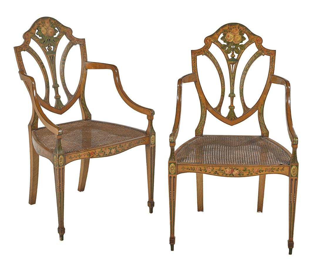 Pair of Edwardian Satinwood Armchairs: Pair of Edwardian Satinwood Armchairs early 20th century, in the Adam taste, each with a pierced shield-form back with floral- and rose-painted accents, joined by downswept arms to the cushioned and c