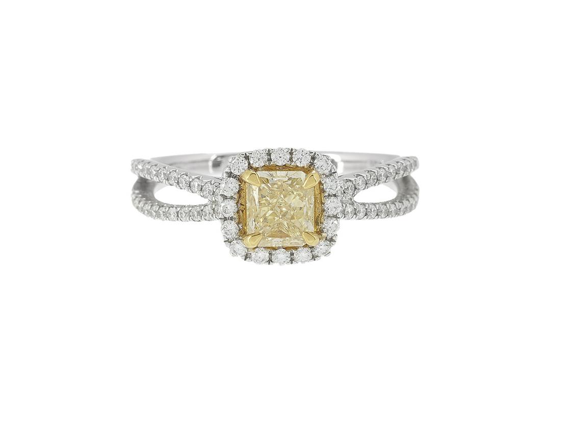 Fancy Light Yellow Diamond Ring: Fancy Light Yellow Diamond Ring 18k white gold, the ring mounted with a rectangular-cut Fancy Light Yellow diamond weighing 0.81 carats, clarity SI1, GIA report #6157789013, accented by round brillian