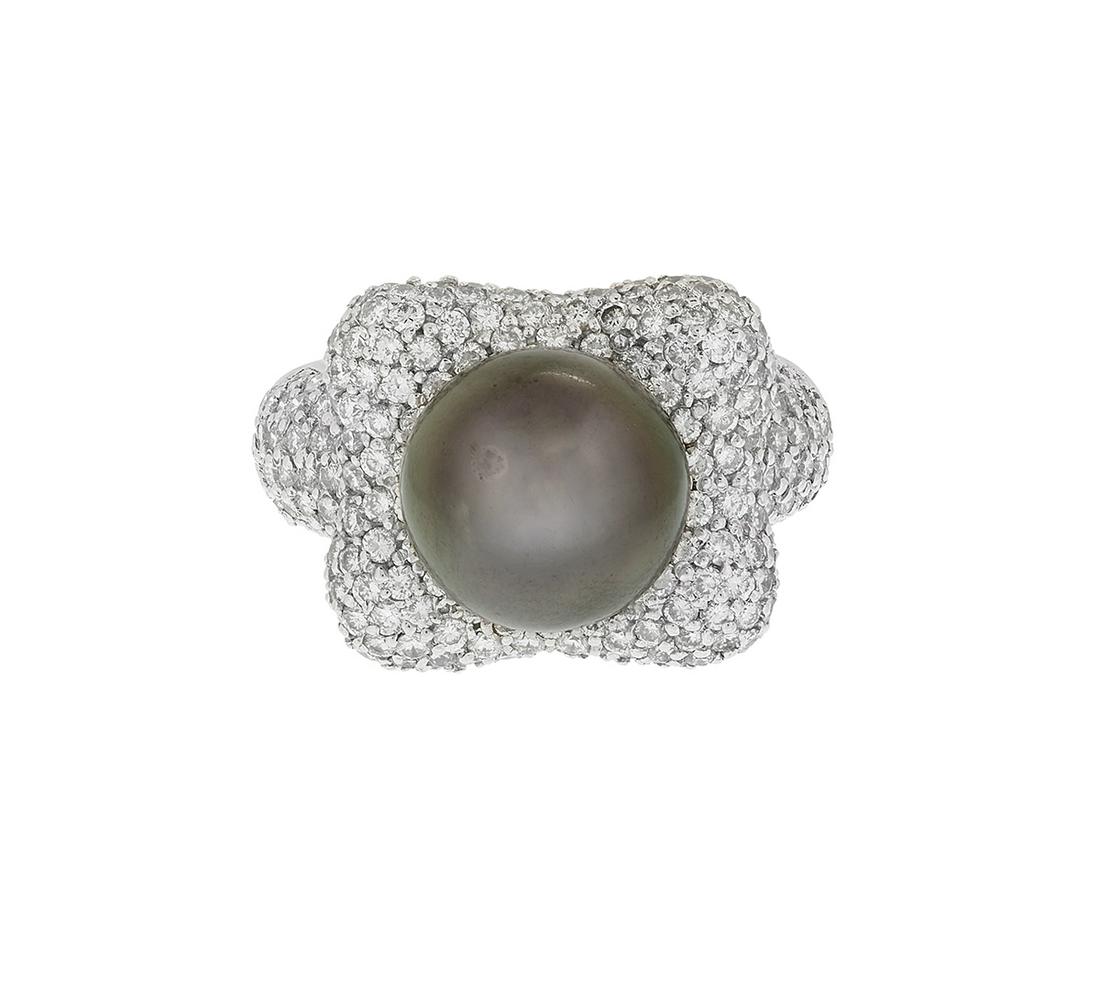Tahitian Pearl and Diamond Ring: Tahitian Pearl and Diamond Ring 18k white gold, the ring mounted with a black Tahitian pearl measuring approximately 11.00 mm in diameter, with a high luster, set on a ring accented on the top and sid
