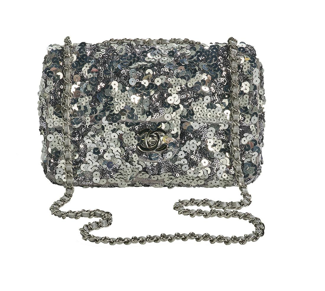 Chanel Silver Sequin New Mini Classic Flap Bag: Chanel Silver Sequin New Mini Classic Flap Bag 2011, silver hardware, the body a silver and gunmetal sequined melange having a rear slip pocket, with silver "CC" turn lock tab closure stamped "Chanel/