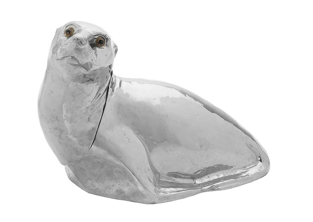 Franco Lapini Silverplate "Seal" Wine Cooler: Franco Lapini Silverplate "Seal" Wine Cooler contemporary, Florence, in the form of a realistically detailed seal pup with glass eyes, the neck hinged and opening to a plastic liner. h. 13-1/4", w. 9-