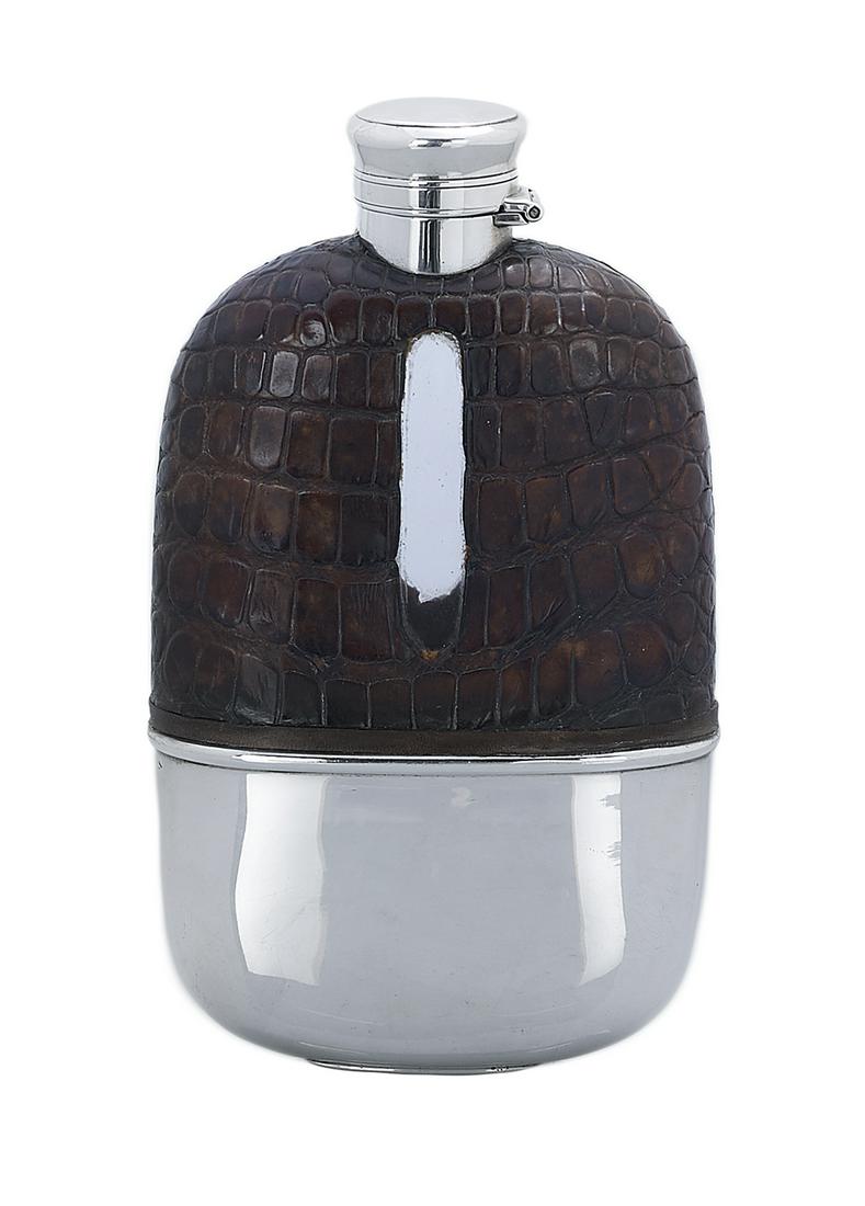 Gorham Silver and Alligator Flask: Gorham Sterling Silver- and Alligator-Mounted Flask 1894, Providence, Rhode Island, the oval glass body clad in alligator skin on the upper half with cutout level window on either side, with sterling