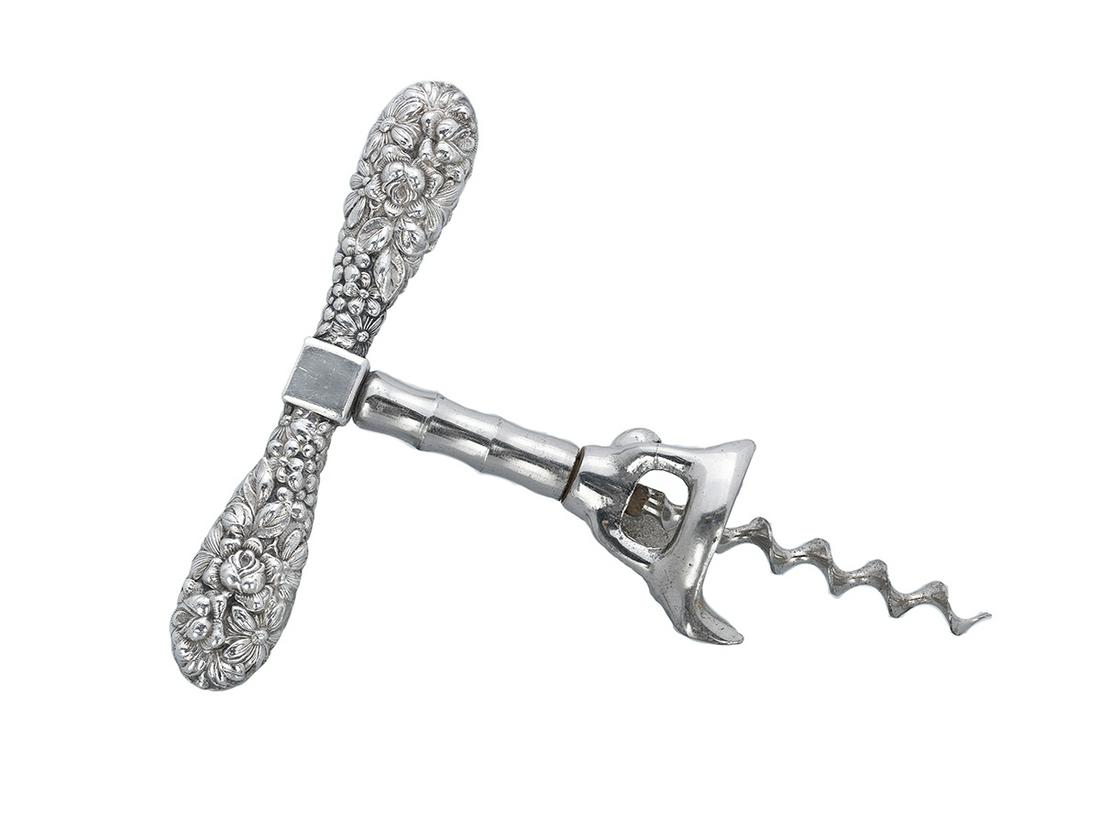 Silver and Steel Walker Bell Corkscrew: "Baltimore Rose" Silver and Steel Walker Bell Corkscrew first quarter 20th century, the handle unmarked, the bell marked "Klinger/Germany", with filled silver repousse floral handle, and steel bell an