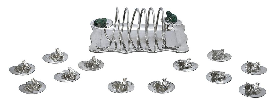 Emilia Castillo Silverplate "Frog" Tableware: Collection of Emilia Castillo Silverplate "Frog" Tableware contemporary, Taxco, Mexico, including: a set of twelve place card/menu holders, each in the form of two frogs on a lily pad, w. 2"; and a to