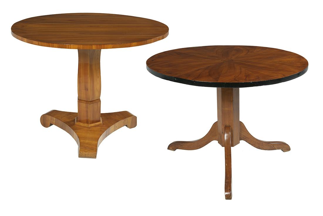 Two Biedermeier Fruitwood Center Tables: Two Biedermeier Fruitwood Center Tables mid-19th century, one with a highly figured circular top above a paneled columnar standard to a concave tripartite base with scrolled feet, h. 30", dia. 39-1/2"