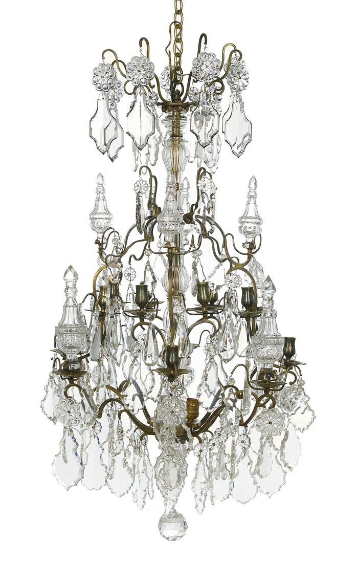 Baroque-Style Bronze and Crystal Chandelier: French Baroque-Style Bronze and Crystal Chandelier second quarter 20th century, the twenty-four-light chandelier with a molded glass-clad standard set with scrolled bronze arms terminating in bell-for