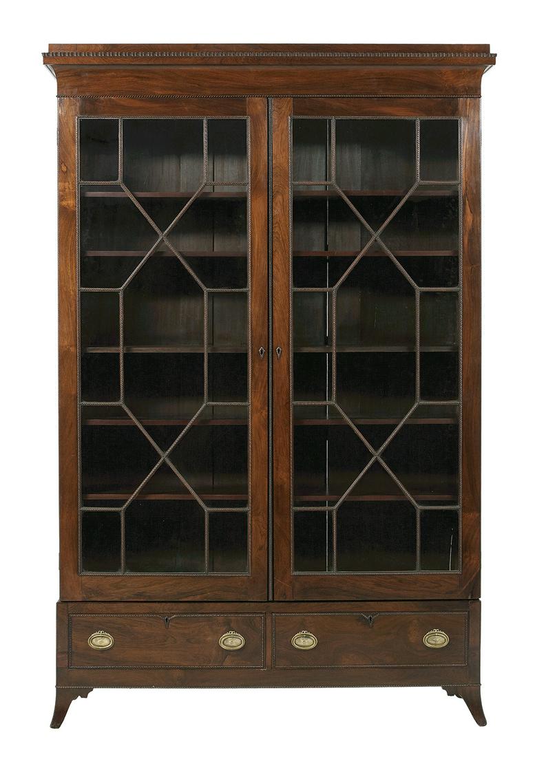 Fine Hepplewhite Rosewood Bookcase: Fine Hepplewhite Rosewood Bookcase early 19th century, the chamfered and carved cornice over a case fitted with a pair of astragal-glazed doors above an apron with two drawers, raised on sabre legs. h