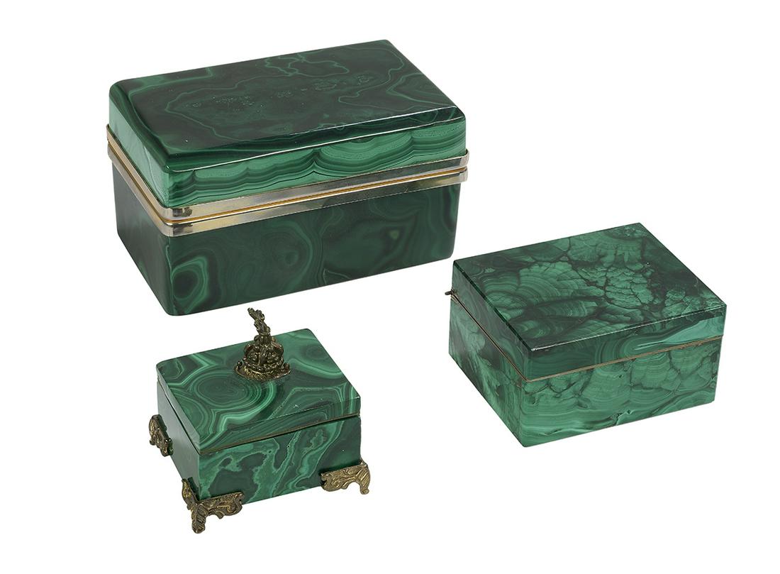 Three Malachite Boxes: Three Malachite Boxes 20th century, with brass fittings, the smallest box on scrolled feet and with a pierced finial. h. 2-1/4" to 2-1/2", w. 2" to 4-1/4", d. 1-3/4" to 2-1/2" Provenance: The Estate o