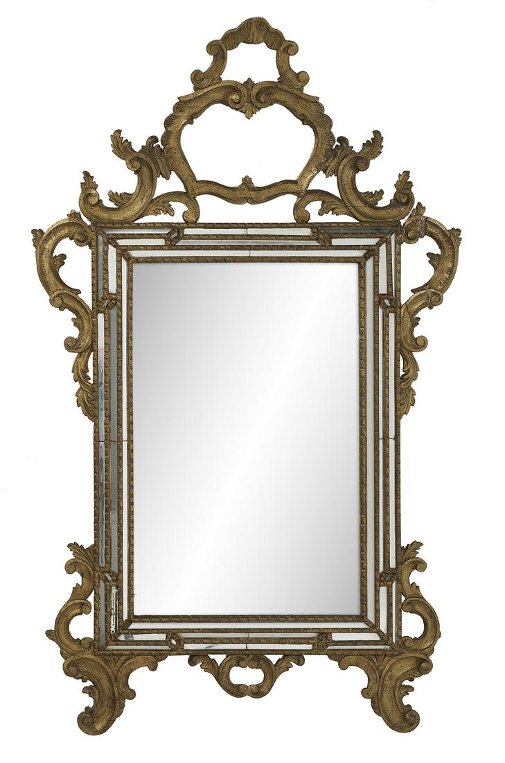 Italian Giltwood Mirror in the Rococo Taste: Italian Giltwood Mirror in the Rococo Taste mid-20th century, the mirror-inset frame with a cushion surround with notched giltwood, the pierced and scrolled crest with leaf-carved flourishes and a cen