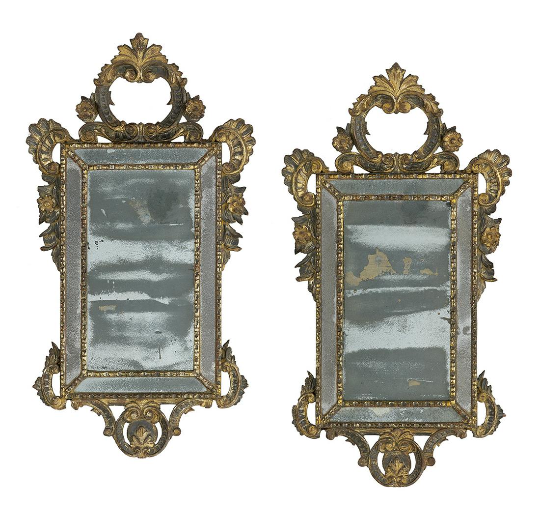 Pair of Venetian Rococo-Style Polychrome Mirrors: Pair of Venetian Rococo-Style Polychrome and Parcel-Gilt Mirrors early 20th century, each of cushion form, with a pierced and carved rocaille-work crest, a like lower portion, and scrollwork and flora