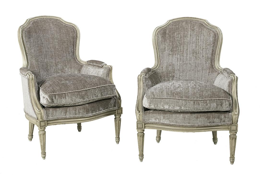 Pair of Louis XV-Style Polychrome Bergeres: Pair of Louis XV-Style Polychrome Bergeres second half 20th century, each with a carved and molded crest over a conforming padded back, joined to the cushioned seat by like arms, raised on fluted tape