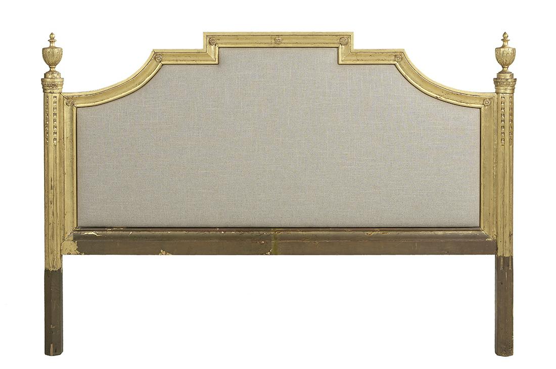 French-Style Carved and Giltwood Headboard: French-Style Carved and Giltwood California King-Size Headboard in the Louis XVI taste, the outer frame deeply molded and adorned with carved rosettes in the corners, the posts with urn-carved finials