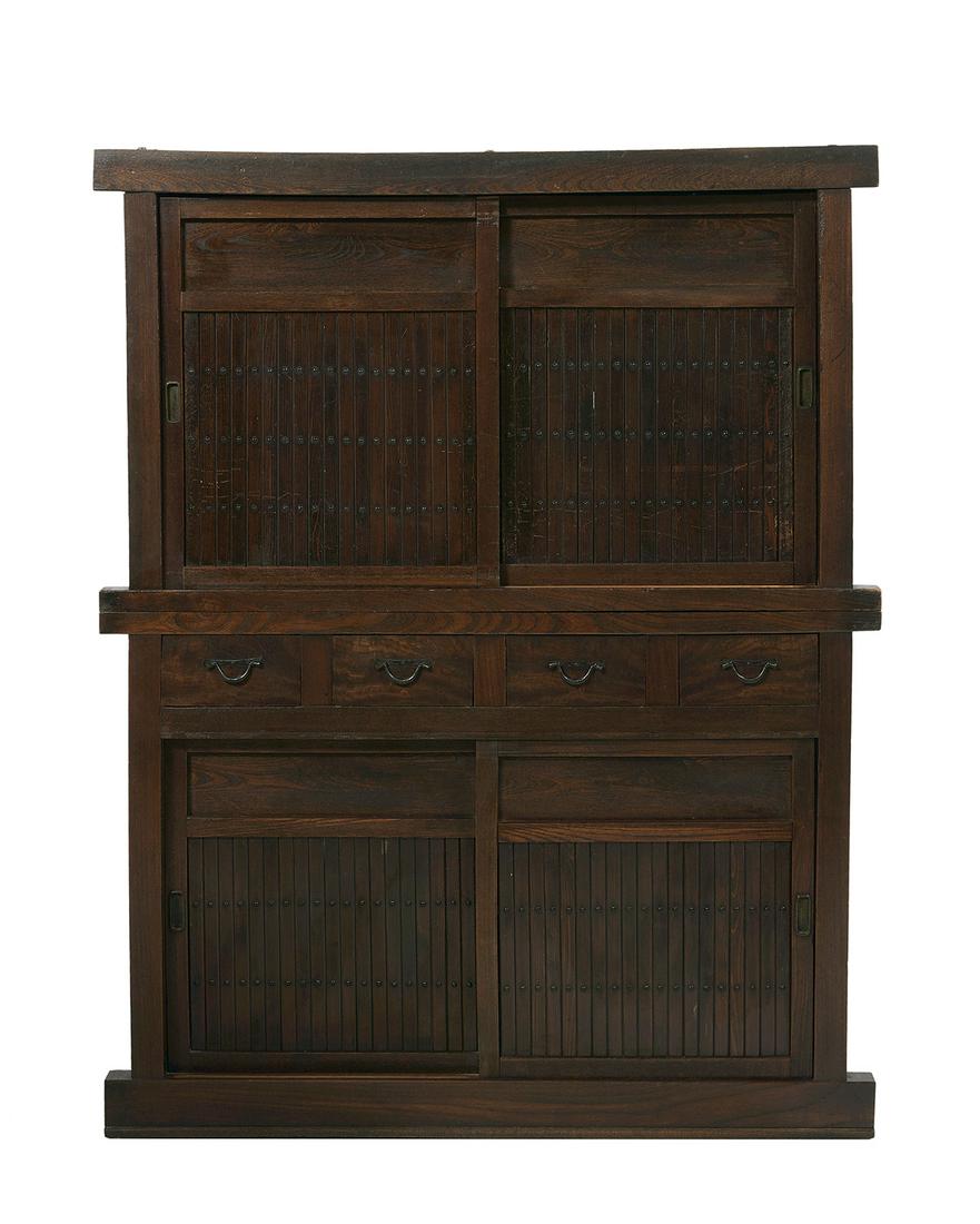 Japanese Hardwood Two-Part Mizuya Tansu: Japanese Hardwood Two-Part Mizuya Tansu late Meiji period, fourth quarter 19th/first quarter 20th century, the upper section with paneled sliding doors, the lower section with four short drawers havin