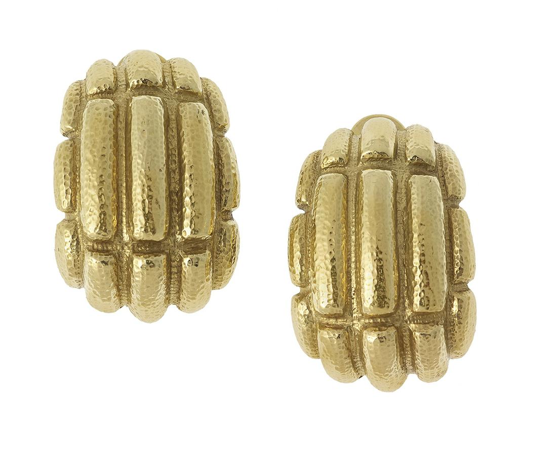 Pair of David Webb Ear Clips: Pair of David Webb Ear Clips 18k yellow gold, the heavy ear clips with a hammered finish, stamped, "WEBB 18K". l. 1-3/8", total weight 62.5 grams Provenance: The Estate of The Honorable Lloyd & Beryl