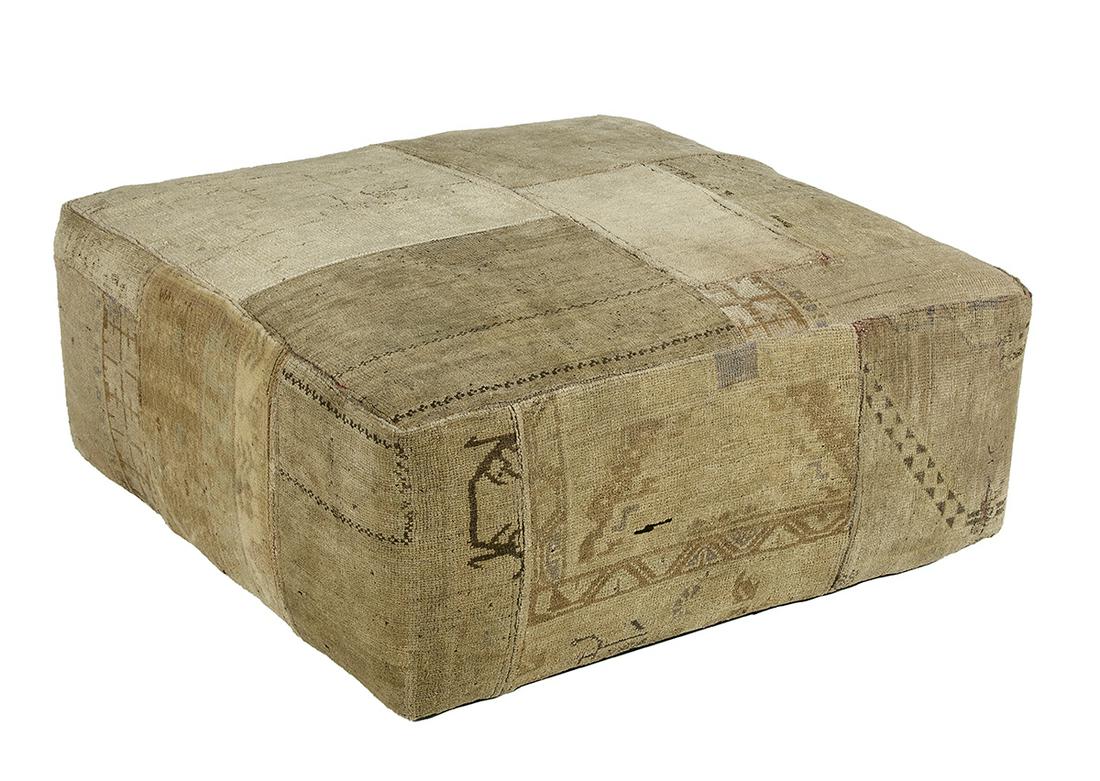 Interesting Oushak Carpet-Covered Ottoman: Interesting Oushak Carpet-Covered Ottoman composed of antique Oushak carpet fragments stitched together as an upholstery covering. h. 18", w. 42", d. 42"
