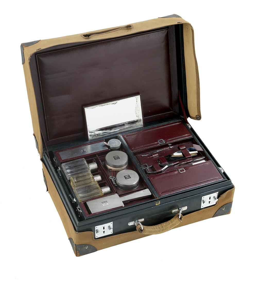 Dunhill Leather Traveling Dresser Case: Dunhill Leather Traveling Dresser Case second quarter 20th century, Paris, the case by Alfred Dunhill, Ltd., the silver fittings by Emile Poureyon, the rectangular black leather case opening to reveal