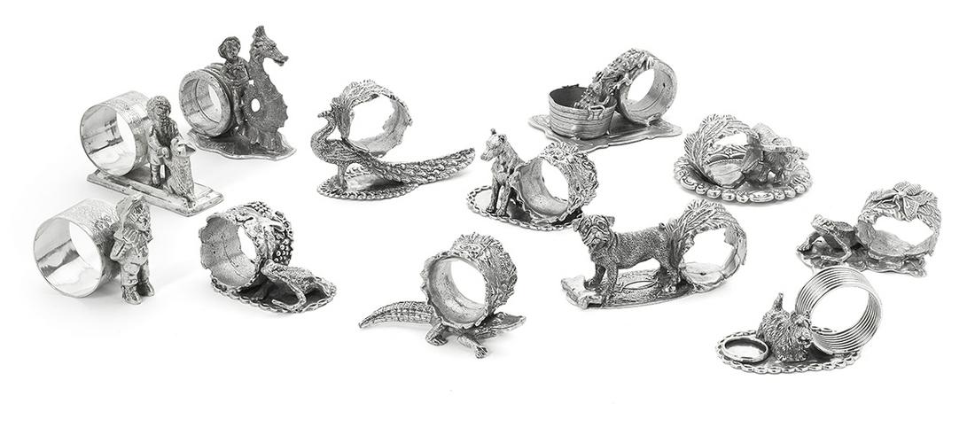 Twelve Silverplate Figural Napkin Rings: Twelve Silverplate Figural Napkin Rings contemporary, cast and assembled from vintage elements, with floral, foliate, grapevine and spiral rings, including two "Kate Greenaway"-type children (one with