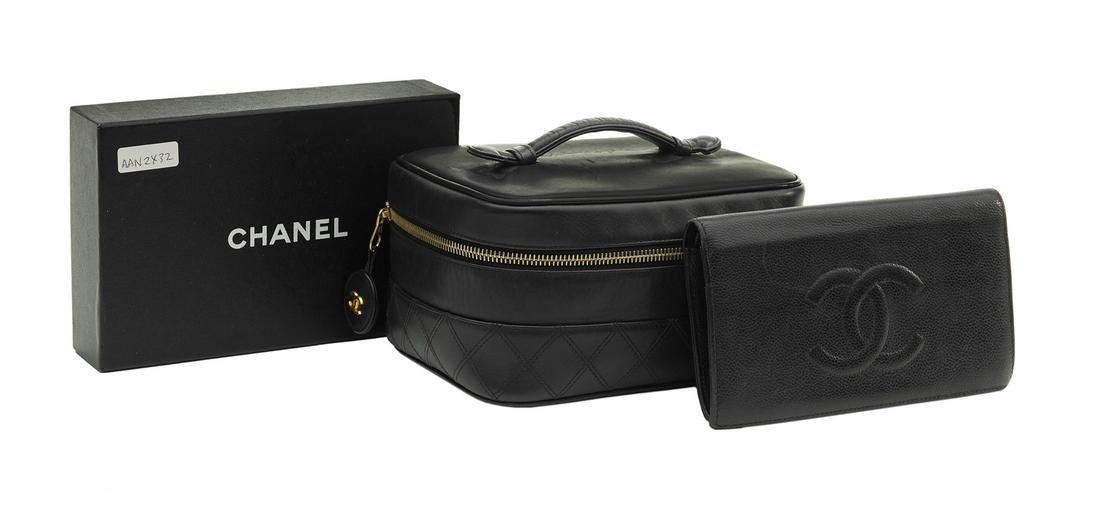 Chanel Black Leather Cosmetic Pouch and Wallet: Chanel Black Leather Cosmetic Pouch and Bifold Wallet the kidskin pouch late 1990s, with gold zippered closure, logo tab and padded slip handle, the self-lined interior edged in black faille and gilt-