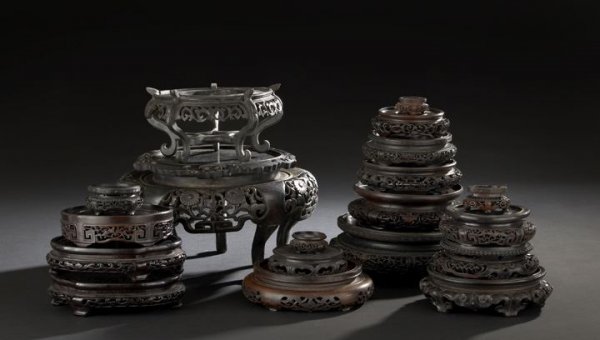 Nineteen Chinese Carved Wooden Display Stands: Group of Nineteen Chinese Carved Wooden Display Stands, including vase and bowl stands in various woods, dia. 2" to 9-1/2".