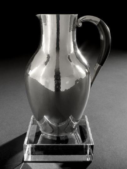 Georg Jensen Sterling Silver Pitcher Number 743: Fine Georg Jensen Sterling Silver Pitcher Number 743, designed in 1934 by Johan Rohde (1856-1935), Copenhagen, of baluster form with scroll-mounted ebony handle and "hammered" finish, h. 7-1/4", dia.