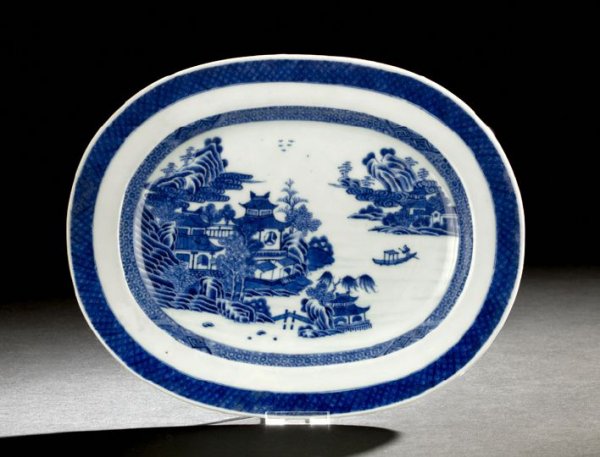 Chinese Export Blue & White Platter: Chinese Export Blue and White Porcelain Platter, 19th century, the rounded rectangular body decorated with a central scene of lakeside pavilions and a lone boatman with an encircling brocade border, t